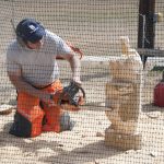 Man carving with chainsaw