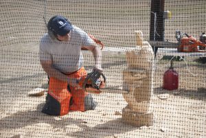 Man carving with chainsaw