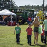 Family at forestry equipment show