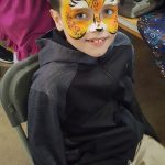 Child with tiger paint